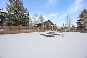 View of yard covered in snow