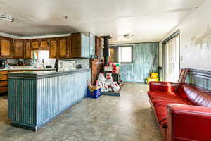 Kitchen with tasteful backsplash and a textured ceiling