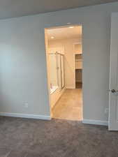 Hallway with light colored carpet