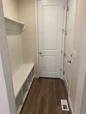 Mudroom with dark wood-type flooring