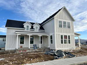 View of front of house featuring a mountain view and covered porch