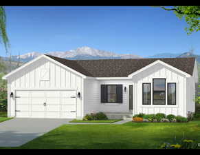 Modern inspired farmhouse featuring an attached garage, a shingled roof, a mountain view, and board and batten siding