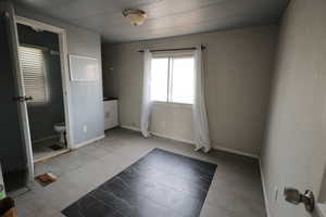 Empty room with tile patterned flooring