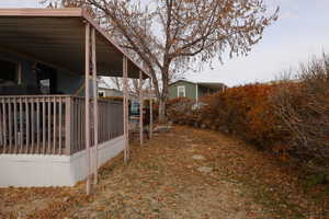 View of yard with a carport