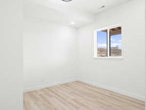 Unfurnished room with light hardwood / wood-style floors