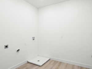 Laundry area featuring hookup for a washing machine, wood-type flooring, and hookup for an electric dryer