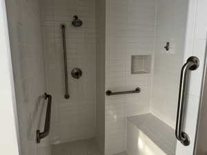 Bathroom featuring tiled shower