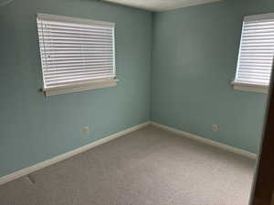 Spare room featuring carpet floors