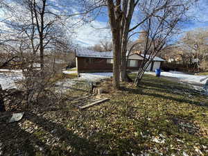 Front yard covered in snow with a garage