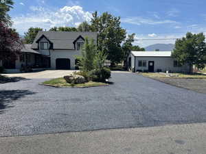 View of front of house featuring a mountain view and a garage