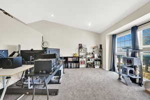 Front Sitting room with vaulted ceilings, and windows