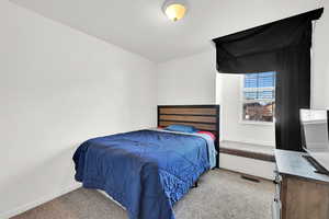 View of carpeted bedroom