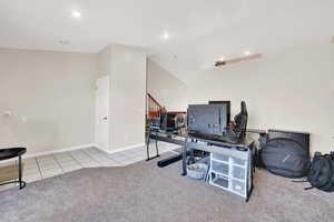 Front Sitting room with vaulted ceilings, and a closet