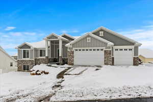 Craftsman inspired home featuring a garage