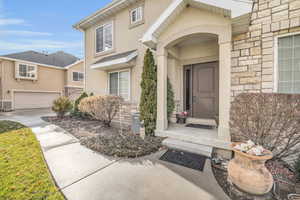 Property entrance featuring a garage