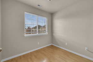 Empty room featuring light hardwood / wood-style flooring