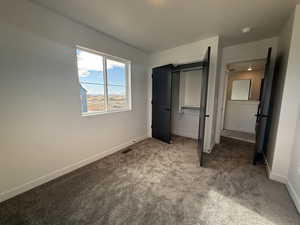 Unfurnished bedroom with carpet