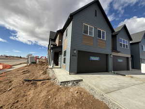 View of front of property with a garage