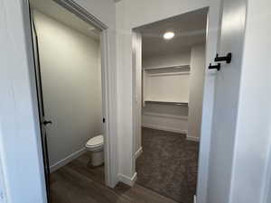 Bathroom featuring toilet and wood-type flooring