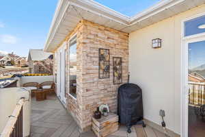 Wooden terrace featuring grilling area