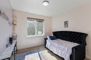 Bedroom featuring carpet flooring, visible vents, and baseboards