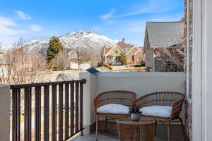 Balcony with a residential view and a mountain view