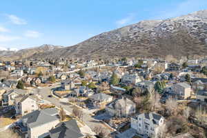 Property view of mountains with a residential view