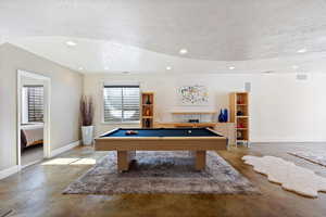 Game room with finished concrete flooring, visible vents, baseboards, a textured ceiling, and recessed lighting