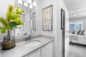 Bathroom featuring vanity and walk in shower