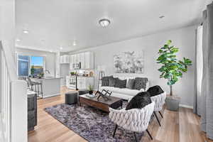 Living room featuring light hardwood / wood-style floors and sink