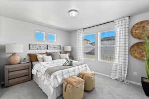 Bedroom with light colored carpet