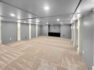 Media room featuring carpet flooring