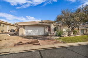 View of front of property featuring a garage