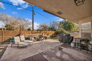 View of patio featuring area for grilling