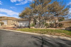 View of front of home featuring a garage