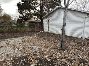 Backyard behind the back of the garage