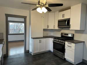 Kitchen with ceiling fan and lots of cabinets