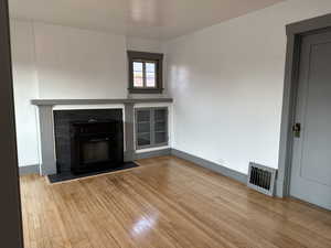 Living room Featuring Decorative Fireplace. (New electric heating/blowing insert is on order)