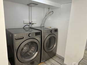 Laundry area with included washer and dryer