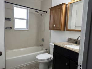 Full bathroom featuring vanity,  tub/shower combination, and toilet