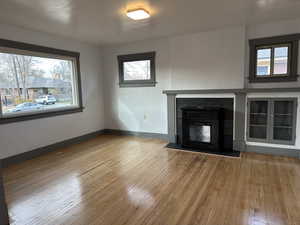 Living room with plenty of natural light and light hardwood floors