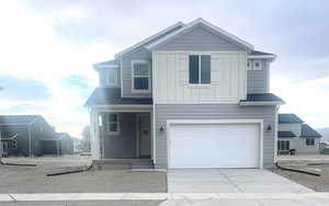 View of front of house with a garage