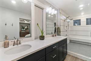 Bathroom with vanity and ceiling fan