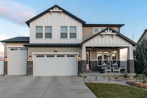 Craftsman house with a porch and a garage