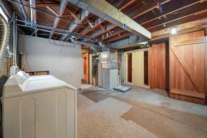 Basement with washing machine and dryer and heating unit