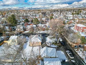 Snowy aerial view featuring a mountain view