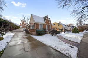 View of front of house with an outdoor structure and a garage