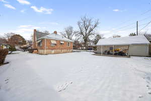 View of yard covered in snow