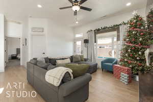 Living room featuring light hardwood / wood-style flooring and ceiling fan