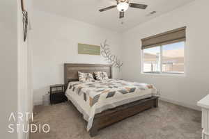 Bedroom featuring ceiling fan and light carpet